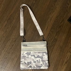 Haute Shore light gray camo purse with star straps.